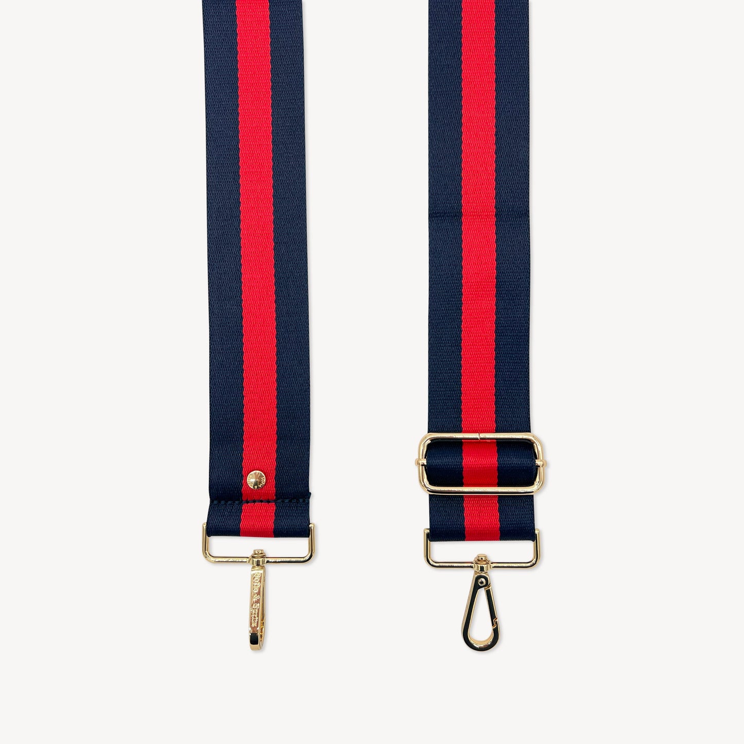 Correa de rayas azul marino y rojas — estilo audaz y clásico a rayas