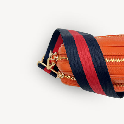 Correa de rayas azul marino y rojas — estilo audaz y clásico a rayas