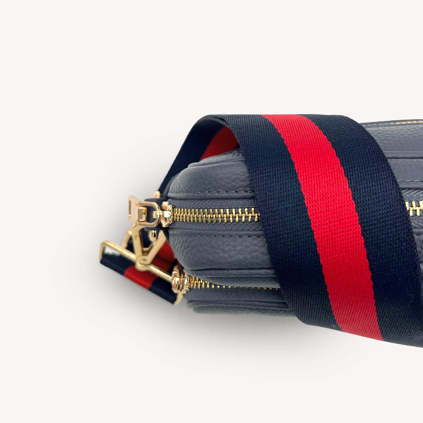 Correa de rayas azul marino y rojas — estilo audaz y clásico a rayas