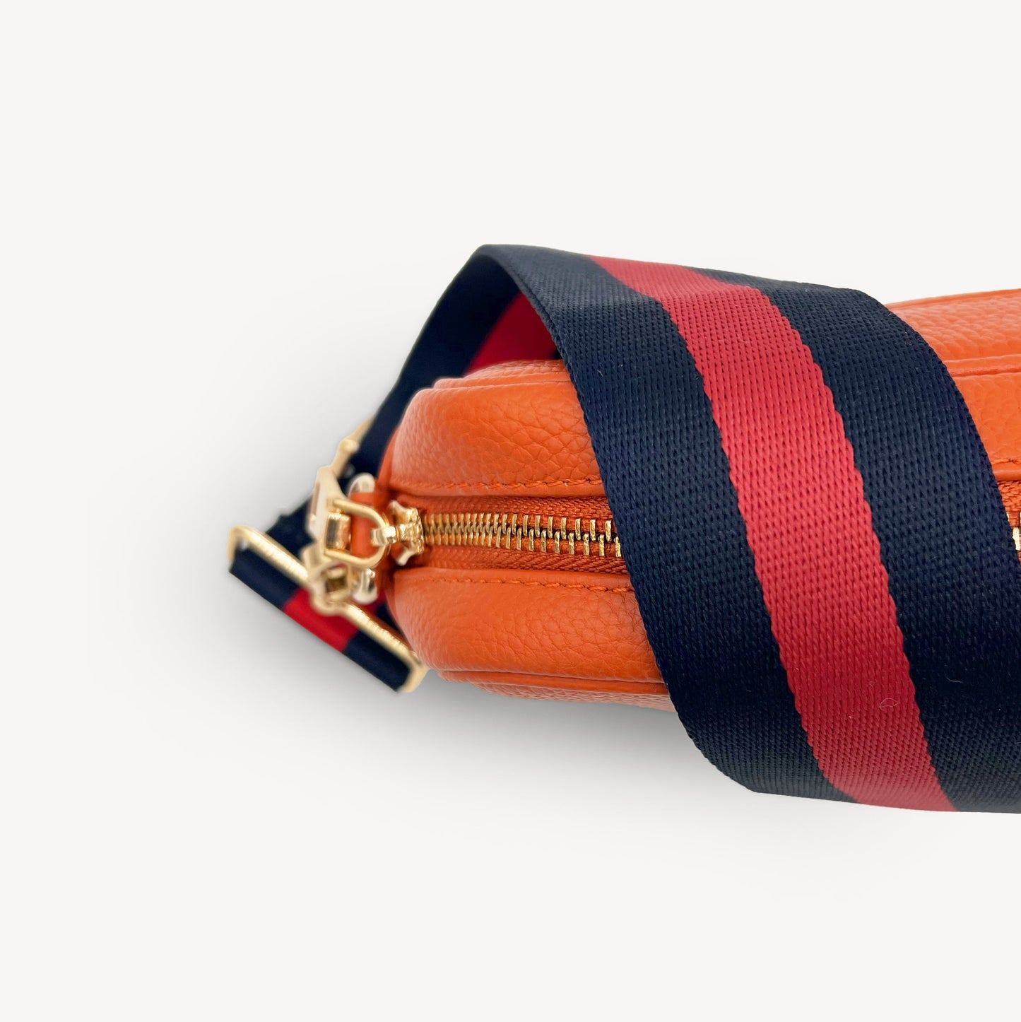 Correa de rayas azul marino y rojas — estilo audaz y clásico a rayas