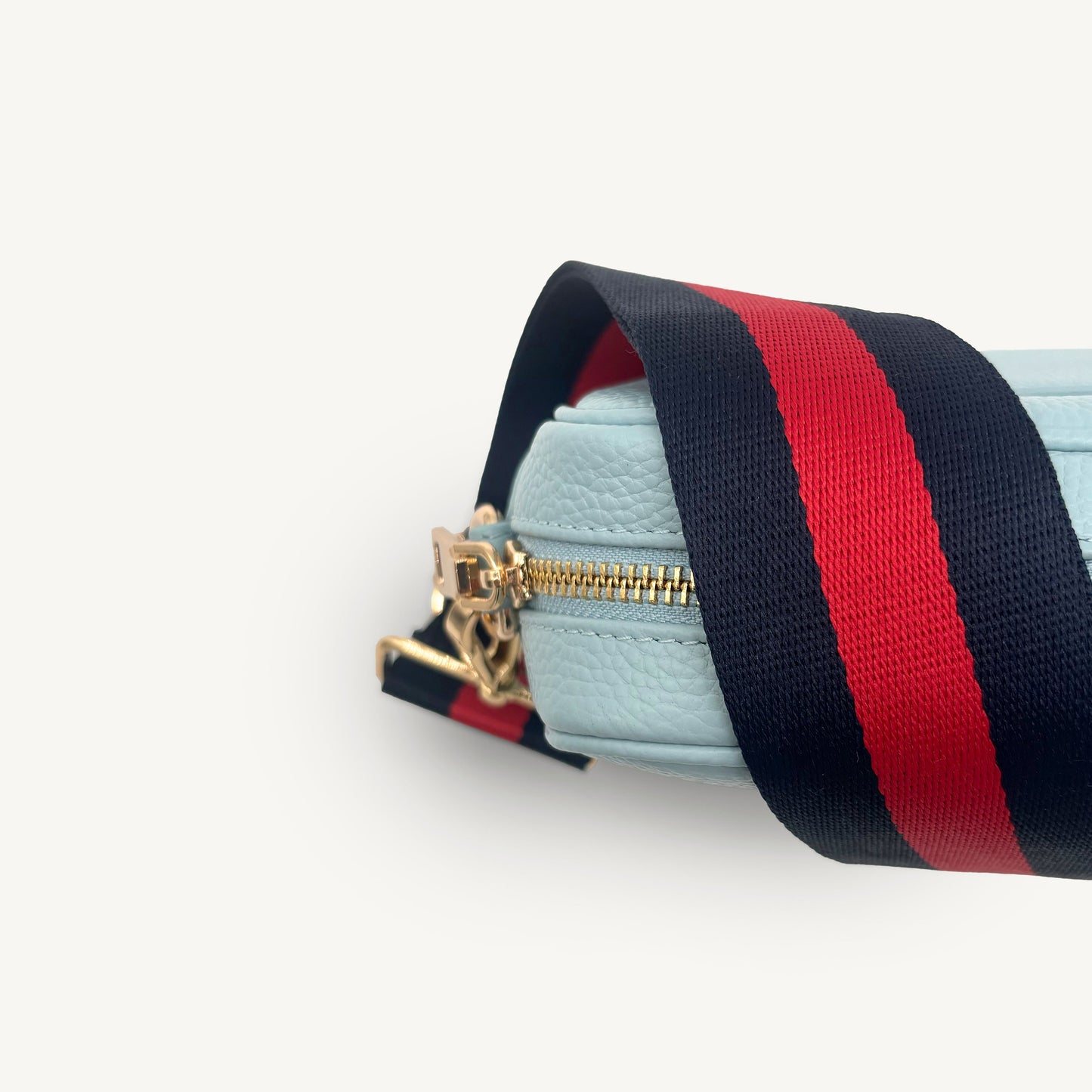 Correa de rayas azul marino y rojas — estilo audaz y clásico a rayas