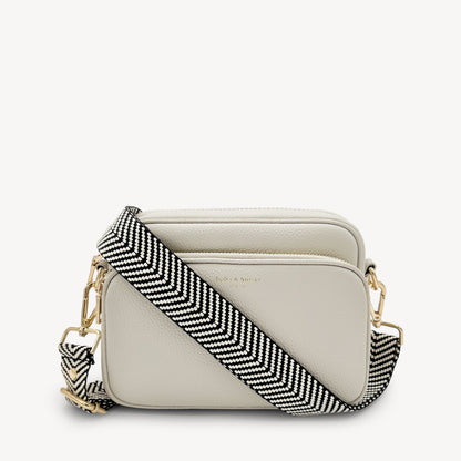 Correa elegante en negro y blanco con diseño chevron