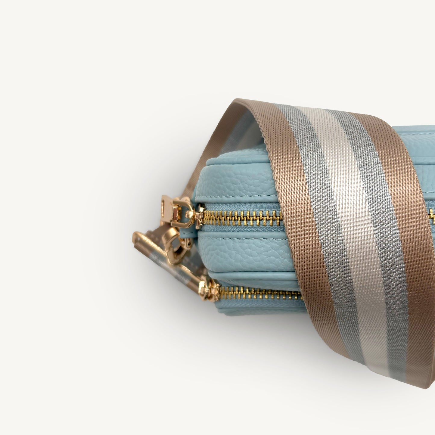 Correa a rayas champán y plata — accesorio lujoso y elegante