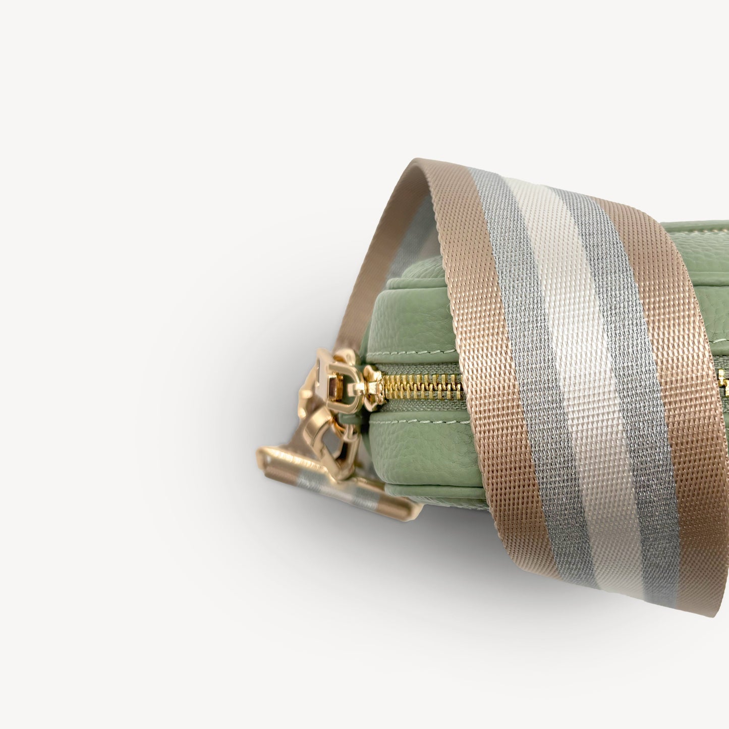 Correa a rayas champán y plata — accesorio lujoso y elegante