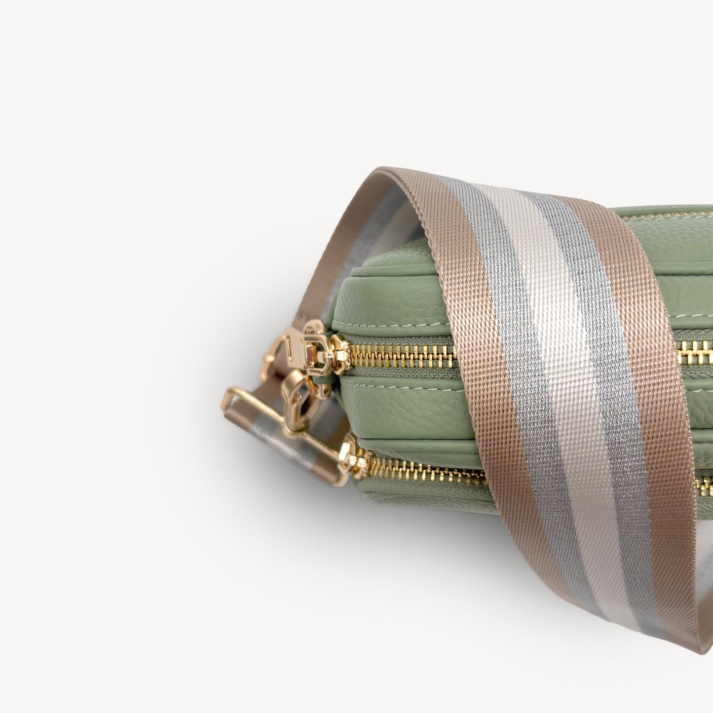 Correa a rayas champán y plata — accesorio lujoso y elegante