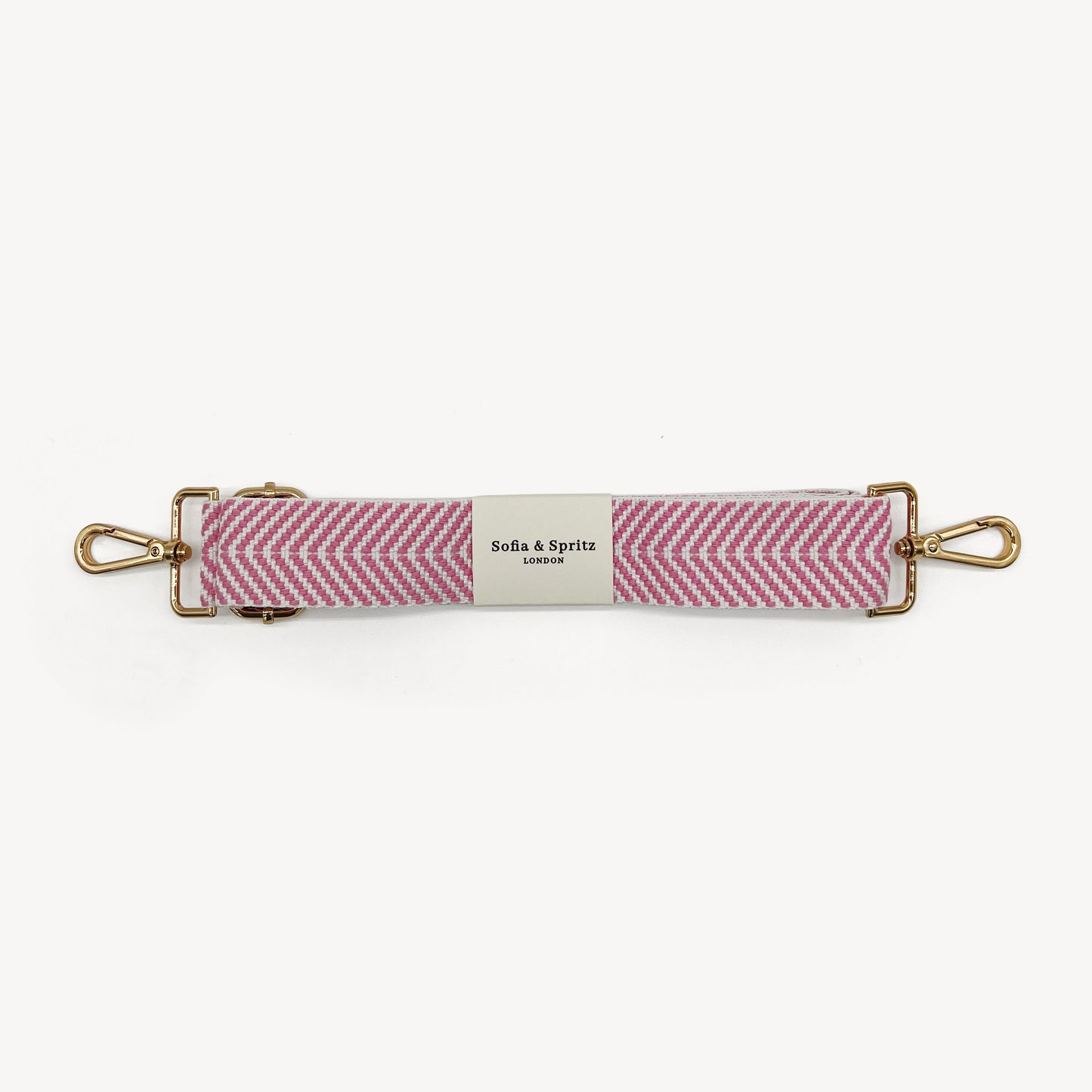 Correa elegante en rosa pálido y blanco con patrón chevron
