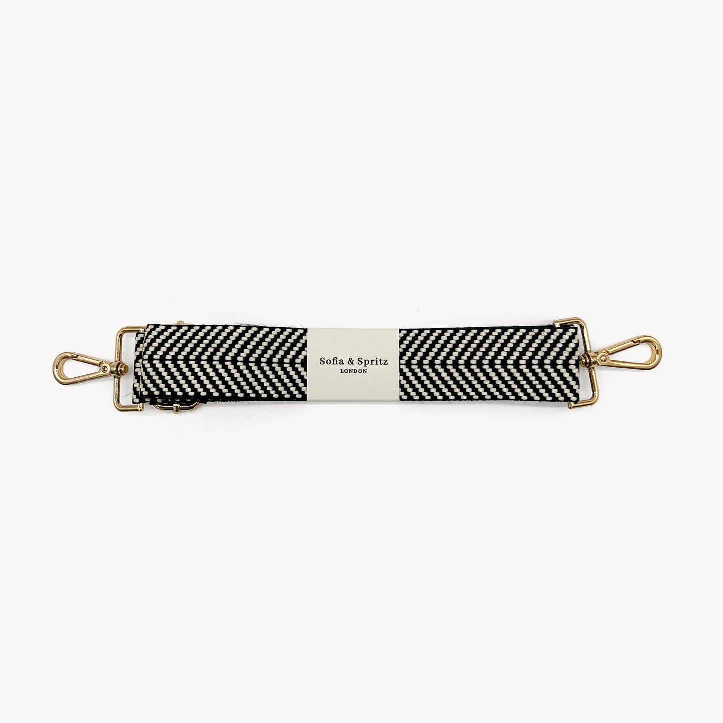 Correa elegante en negro y blanco con diseño chevron