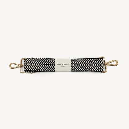 Correa elegante en negro y blanco con diseño chevron