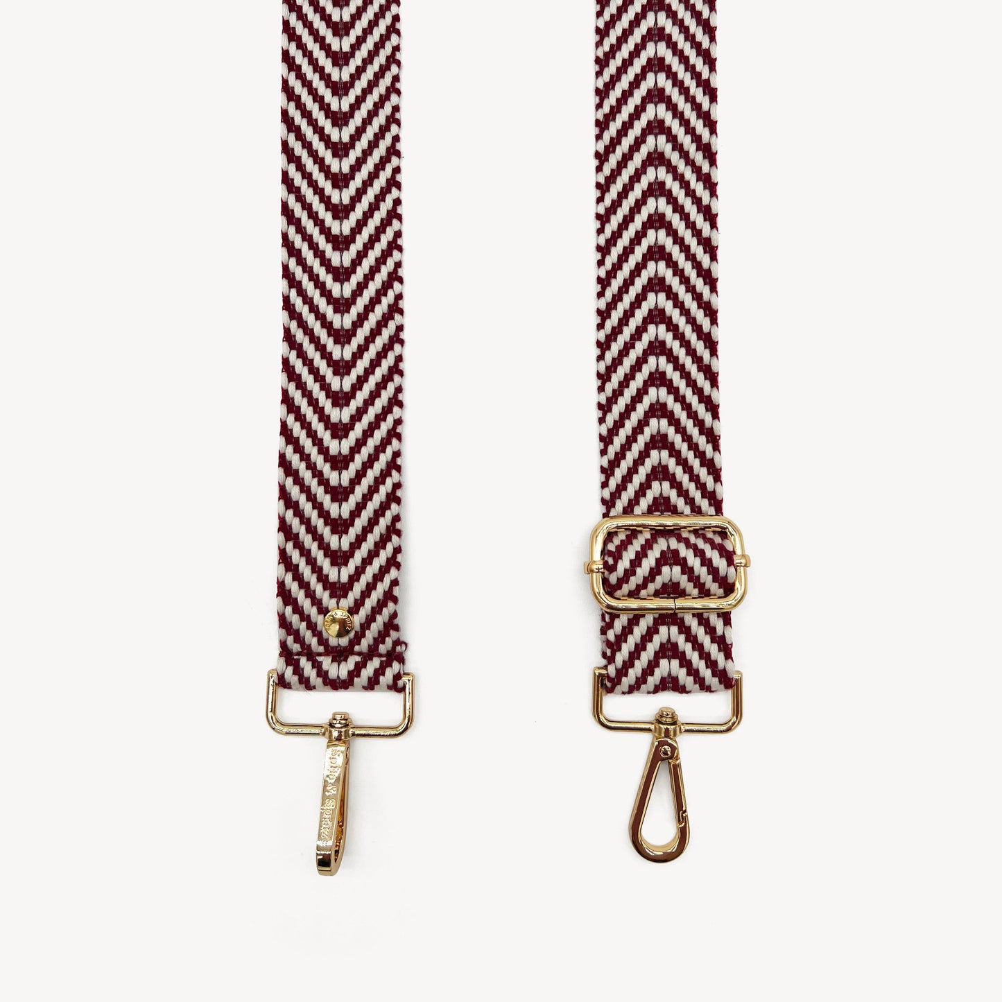 Correa de color burdeos y blanco con patrón en zigzag - Accesorio chic y moderno