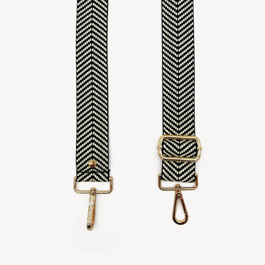 Correa elegante en negro y blanco con diseño chevron